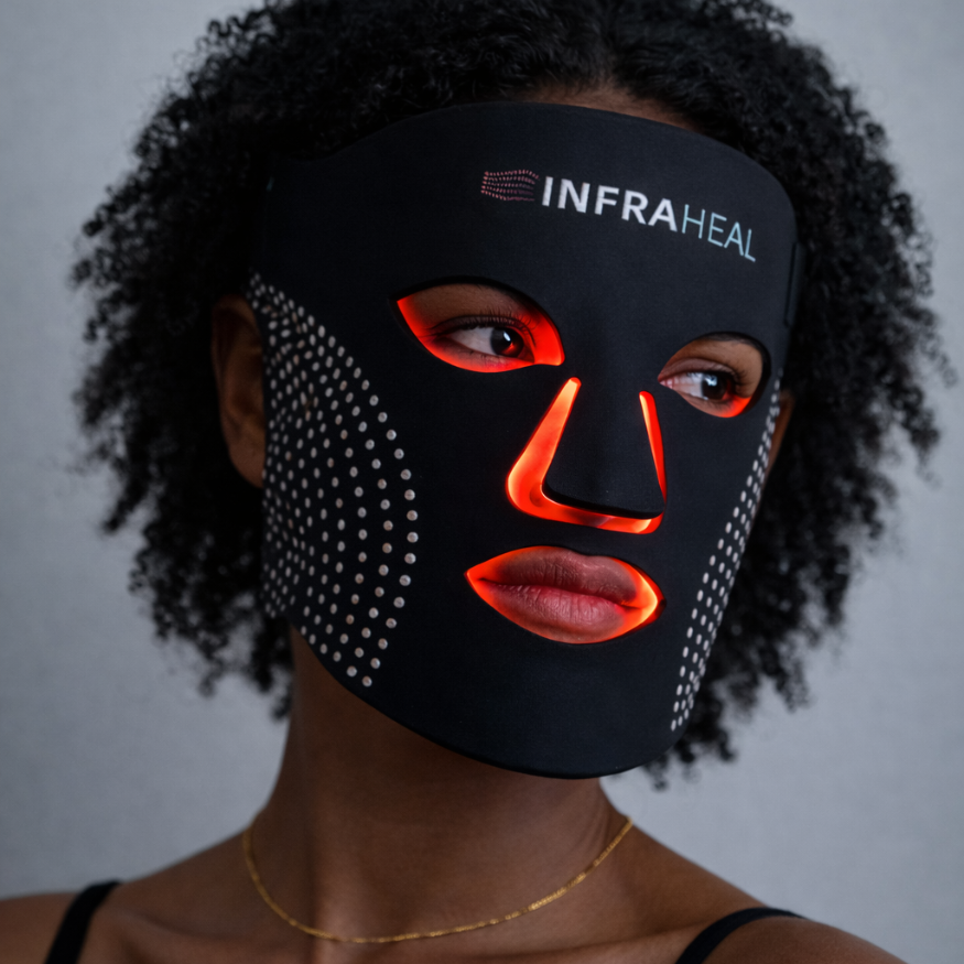 Woman wearing the InfraHeal LED red light therapy face mask